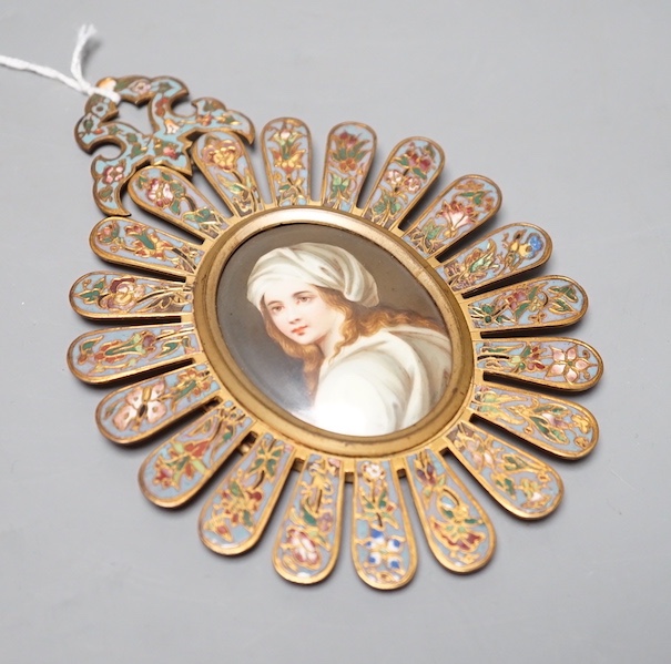 An 19th century Paris porcelain portrait miniature of a lady in a champleve enamelled frame. 13.5cm total exterior frame length